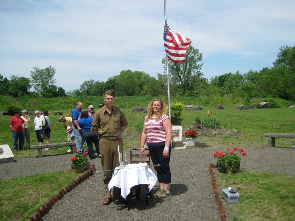 After the emotional ceremony, which ended with the "Fallen Soldier's Table" moment (Jessica Knapp, Youth Commission Chair) and playing Taps (Steven Snyder, a young bugler from RVHS). Photo by Manuela Michailescu.
Michailescu's husband Jon, designed the Veterans Park and at the time, Manuela was Town Board Liason to the Historic Preservation Commission in charge of the project, "Fighting against delays," she said, "It was my obsession to have it ready before we lose more and more Veterans, and the satisfaction of having them attend few ceremonies before passing was huge. During the last year we lost Harry Christian (who brought his boats for Memorial Day 2013), Clifford Knudsen, Charlie Fisher... and now Shawn."