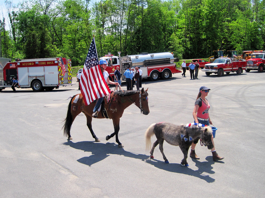 Kim Harris riding SweetieBelle and her mom, Leslie with Sparkles in the Memorial Day Parade.