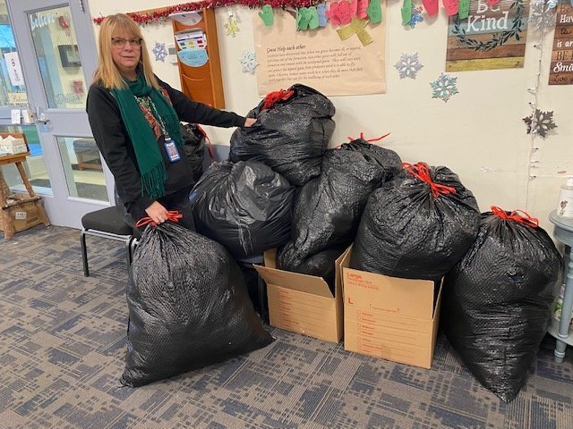 Barbara Crusher, Rondout Intermediate school office administrator, helps with clothing donations.