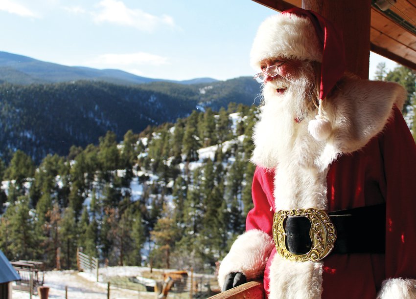 "Santa" Bill Lee looks out over the Laughing Valley Ranch from his porch on Dec. 16.