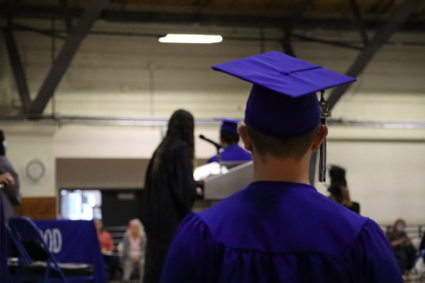 An Englewood High School senior waits to be called on stage to receive their diploma.