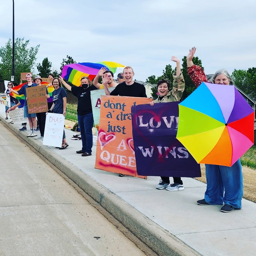 Members of Indivisible Highlands Ranch counter-protest on May 28 in support of an upcoming drag comedy show hosted by the Highlands Ranch Community Association. Indivisible will also host a counter-protest on June 17 to oppose a planned rally from Freedom Fathers, an anti-LGBTQ group.