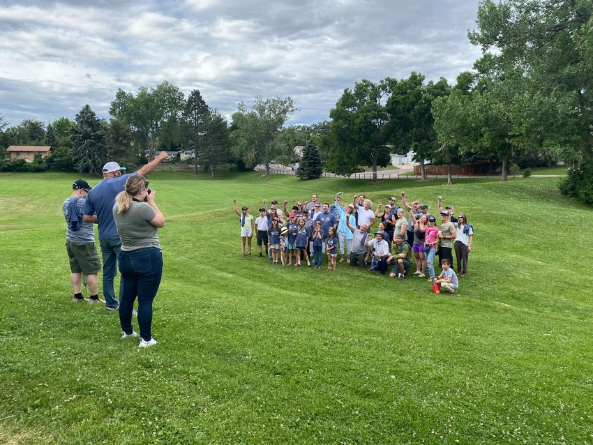 Before heading out to their projects for the day, about 50 volunteers gathered for a group photo for Englewood's Day of Service on June 18, 2022, at Rotolo Park.