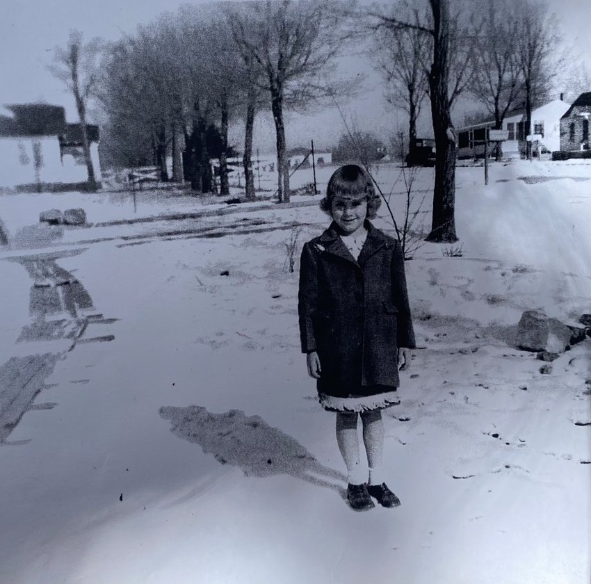 During the day of service event on June 18, 2022, Virginia Keller showed a copy of an image taken of her in about 1950. She was standing in the front yard of her current home in Englewood. There were a lot of elm trees at the time, she said, and the sidewalks were wooden planks.