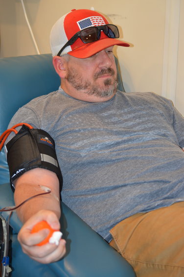 Brent Millspaugh donating blood on July 1, 2022, in the Vitalant bloodmobile.