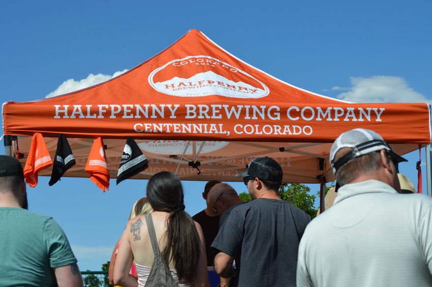 One of the breweries at the "Brew-N-Que" event on July 9, 2022, at Centennial Center Park was Halfpenny Brewing Company, which is based in Centennial.