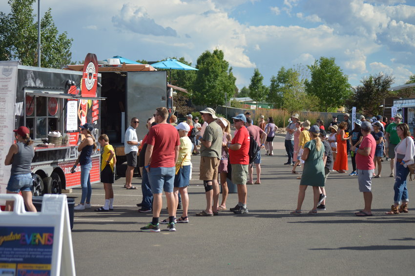 Part of the parking lot at Centennial Center Park was used to host tents and food trucks during Centennial's annual "Brew-N-Que" event July 9, 2022.