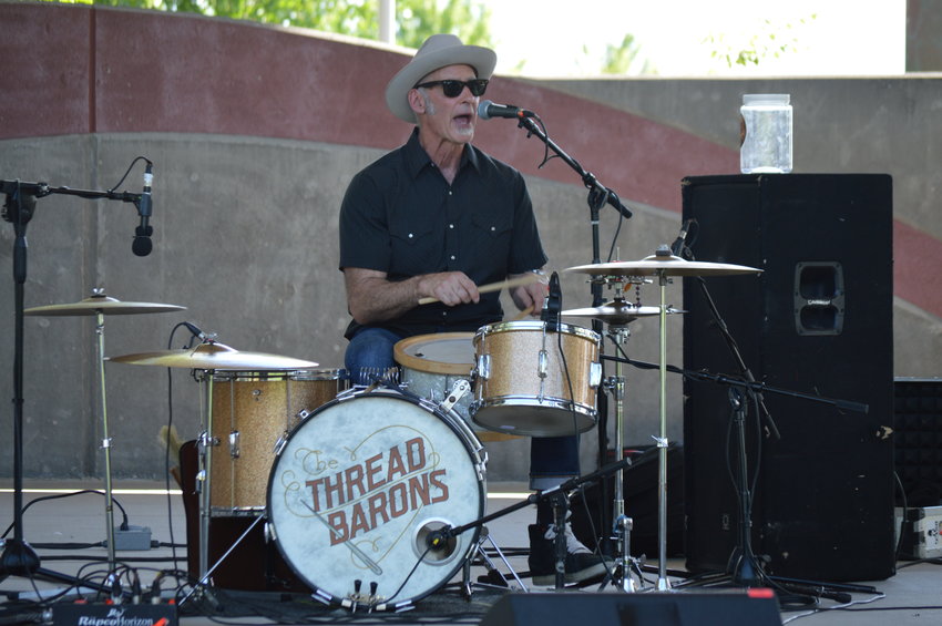 One of the members of The ThreadBarons performing during Centennial's "Brew-N-Que" event on July 9, 2022, in Centennial Center Park.