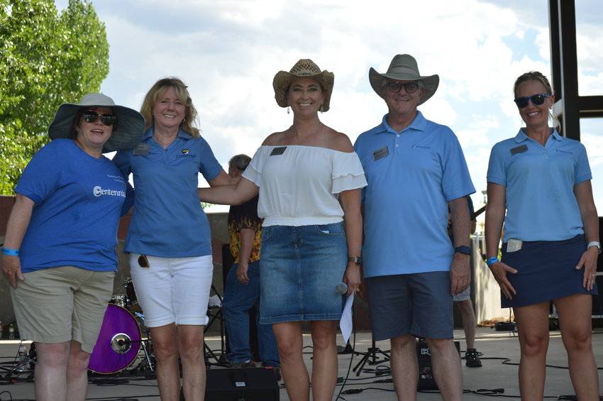 Members of Centennial City Council smiled following a short speech by Mayor Stephanie Piko during Centennial's annual "Brew-N-Que" event on July 9, 2022, at Centennial Center Park. From left to right: Christine Sweetland, Tammy Maurer, Piko, Mike Sutherland and Robyn Carnes.