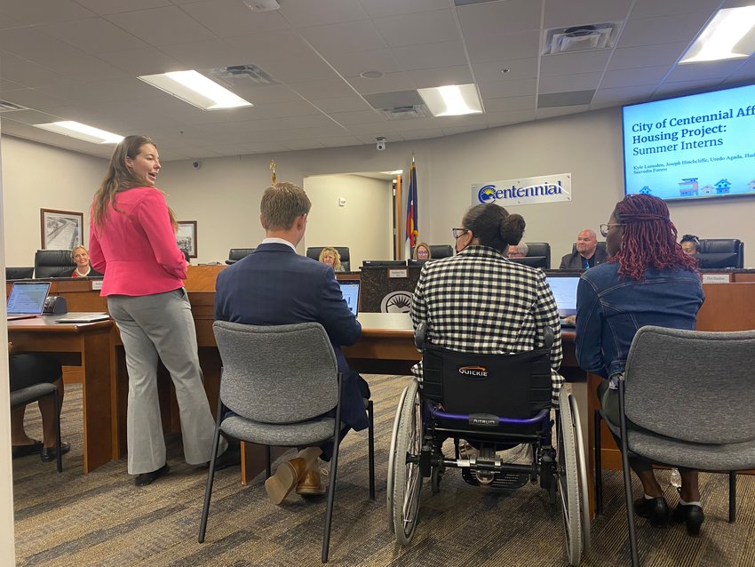 Melanie Ward and interns for the City of Centennial presenting to city council on July 11, 2022, at Centennial Civic Center. From left to right: Melanie Ward,  Hudson Shank, Laura Saavedra Forero and Uredo Agada.