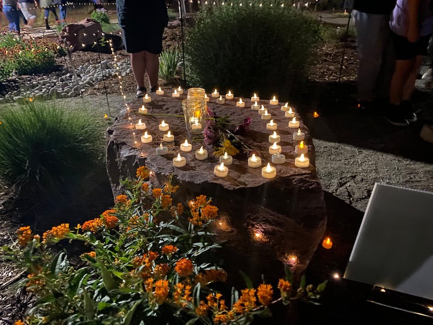 Additional candles were placed on the memorial stone for Veronica Moser-Sullivan, a 6-year-old who died in the Aurora theater shooting, in recognition of other children who have died in mass shootings, such as the Sandy Hook victims, Heather Dearman said. Image taken July 20, 2022.