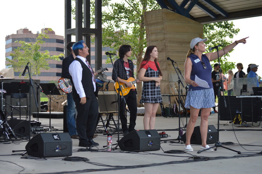Stephanie Piko, the mayor of Centennial and president of the Centennial Arts and Cultural Foundation, introducing the School of Rock at Centennial Center Park on July 31, 2022.