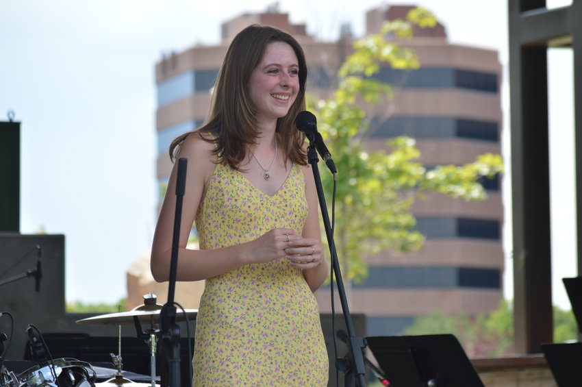 Kylie Bennett, a student at Arapahoe High School, sang during “The Perfect Playlist” concert at Centennial Center Park on July 31, 2022.
