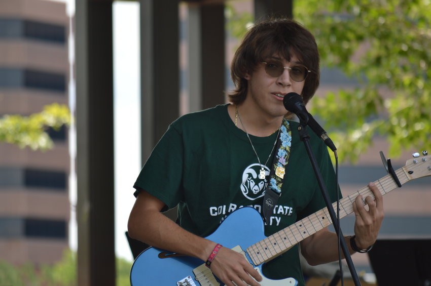 Max Frost, a recent graduate of Arapahoe High School, played guitar and sang during “The Perfect Playlist” concert at Centennial Center Park on July 31, 2022.