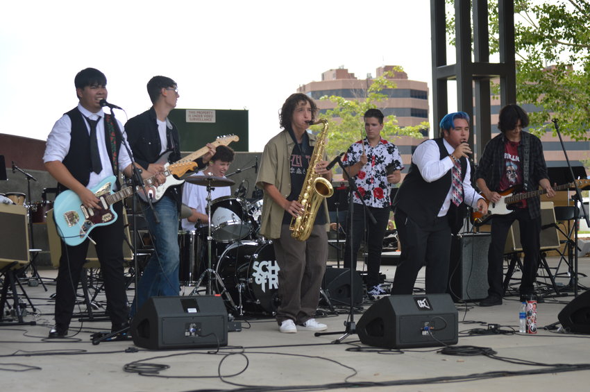 School of Rock Aurora performing at “The Perfect Playlist” concert at Centennial Center Park on July 31, 2022.