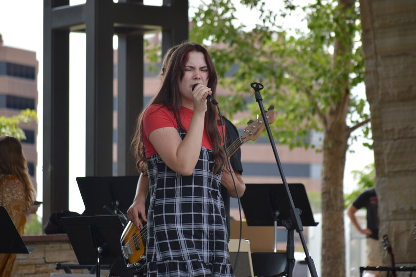 Ellie Brown was one of the main singers who performed during the School of Rock’s setlist at “The Perfect Playlist” concert at Centennial Center Park on July 31, 2022.