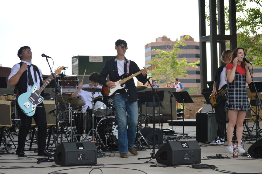 School of Rock Aurora performing at “The Perfect Playlist” concert at Centennial Center Park on July 31, 2022.