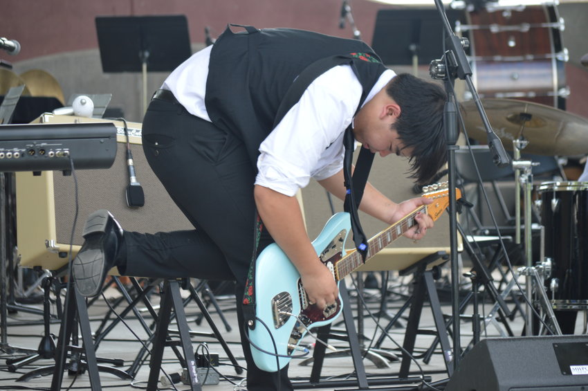 Dominic Dela Paz playing guitar during the School of Rock's performance at “The Perfect Playlist” concert at Centennial Center Park on July 31, 2022.