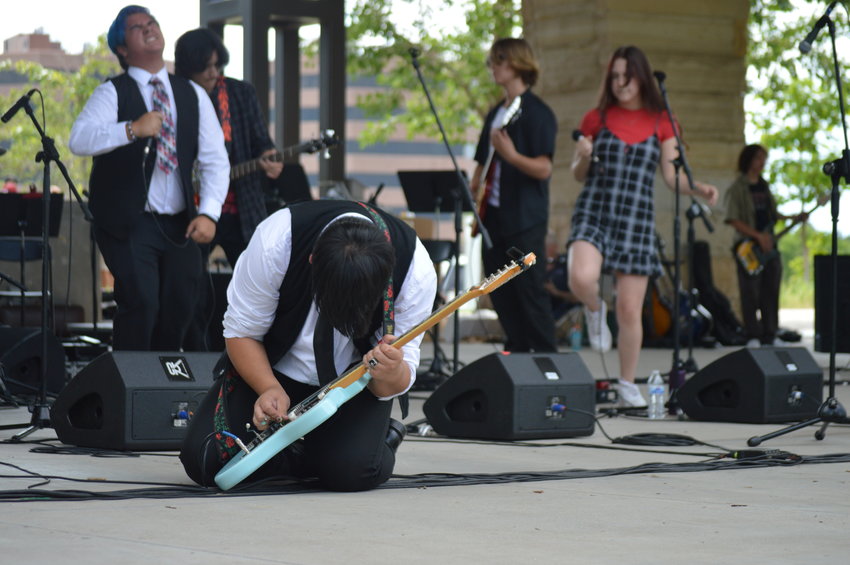 Dominic Dela Paz performs an impressive guitar solo during the School of Rock's performance at “The Perfect Playlist” concert at Centennial Center Park on July 31, 2022.