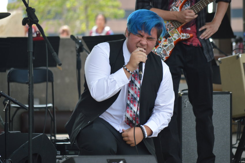 Tristan Shiflett singing during the School of Rock’s setlist at “The Perfect Playlist” concert at Centennial Center Park on July 31, 2022.