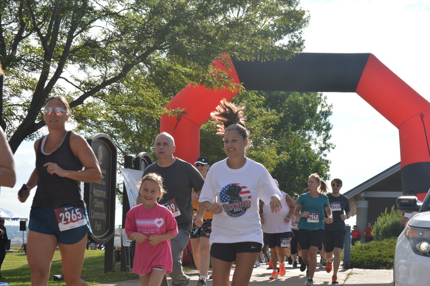 Participants in the Aug. 6 "RexRun" race at Dove Valley Regional Park.