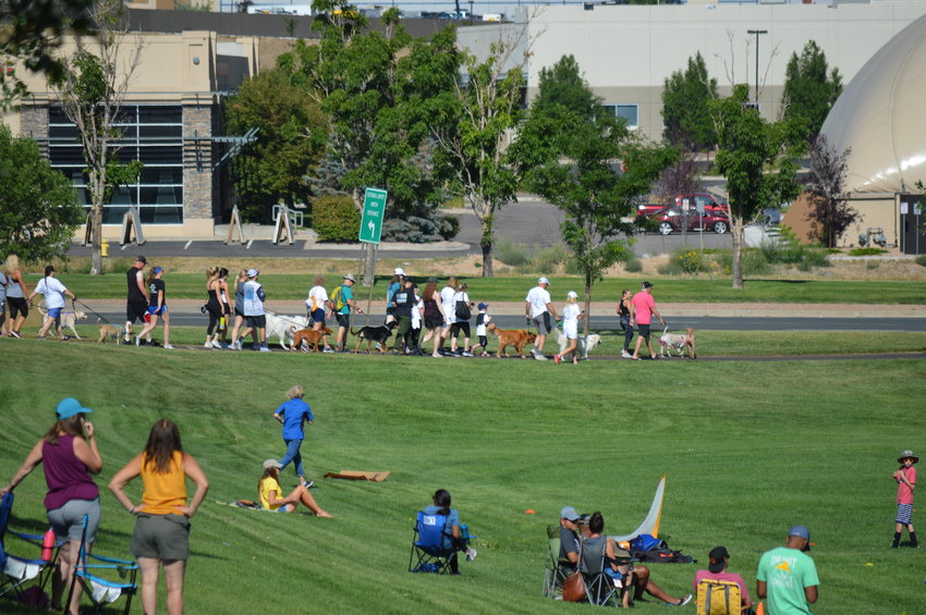 Onlookers watch participants in the Aug. 6 "RexRun" 5K walk at Dove Valley Regional Park.