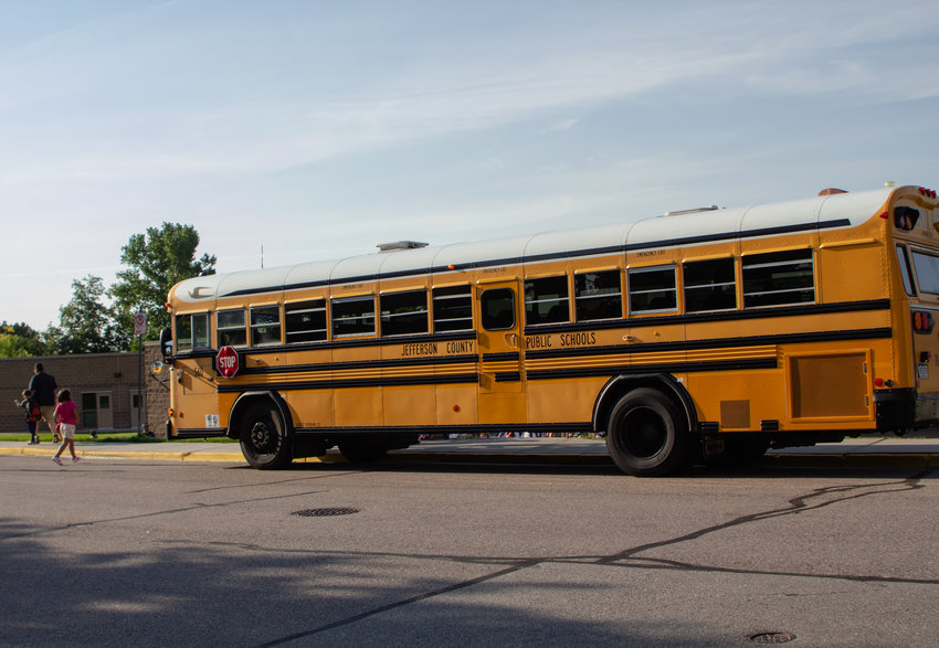 A Jeffco school bus drops students off at Rooney Valley Elementary in Lakewood, Aug. 19.