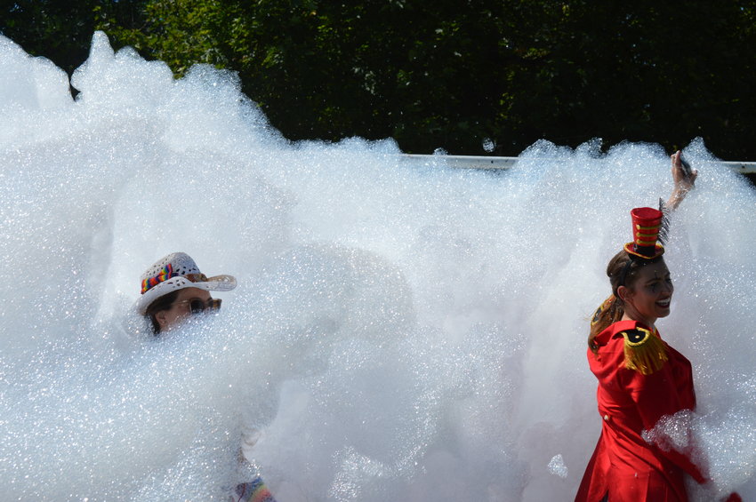 Jaalah Neerhof and Logan Ellett dance in the pile of foam during the Aug. 13 event.