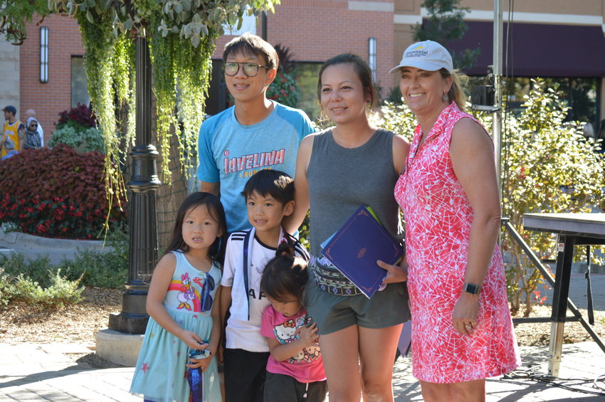 Mayor Stephanie Piko smiles alongside Katherine Chow and her family after “Pokémon Jubilee” won the kids' choice award on Sept. 24.