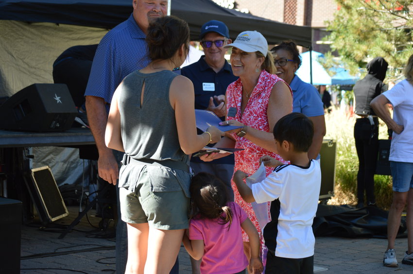 Mayor Stephanie Piko hands Katherine Chow a certificate after winning the kids' choice award on Sept. 24.