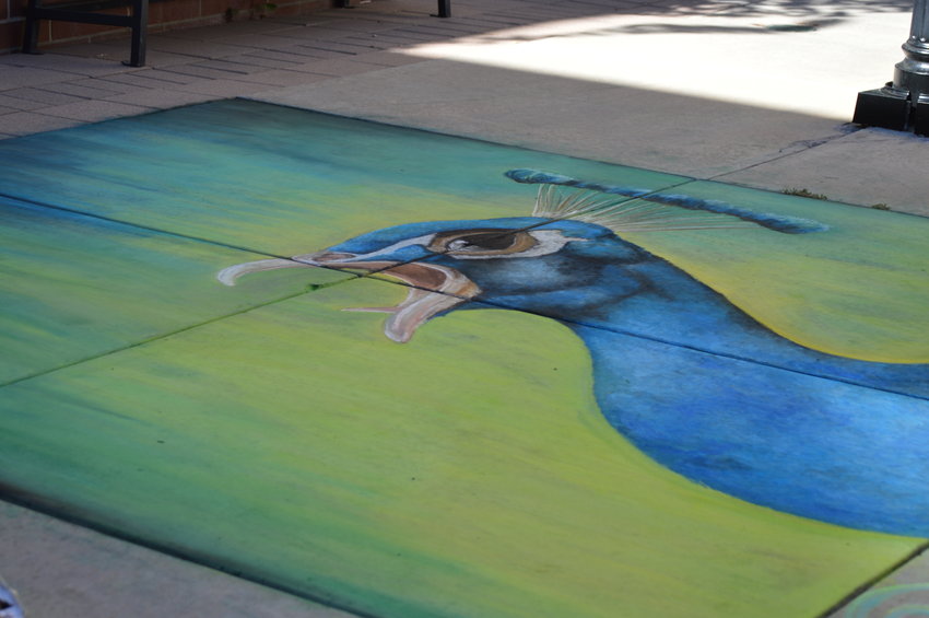Kari Dusenbery named her chalk art piece the “Screaming teacher.”