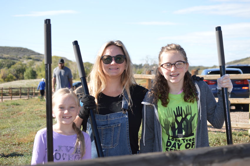 Jennifer Rodina smiles with her two daughters, 13-year-old Alie, right, and 9-year-old Cassie, left, on Oct. 1 at Schweiger Ranch.