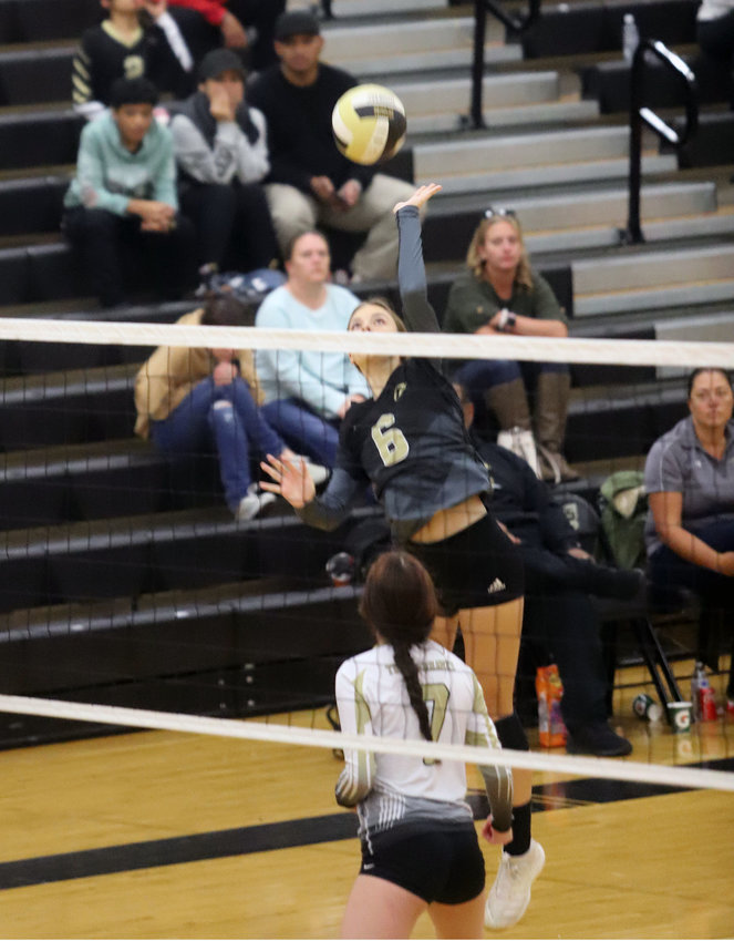 Prairie View's Kendra Roberts spikes the ball during a volleyball match against Mountain Range Oct. 27.