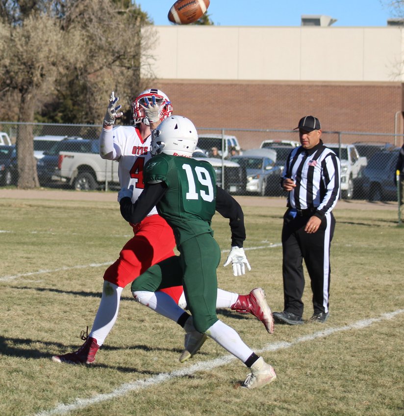 Otis' Jack Willeke snares this long pass against the defense of Stratton's Avery Archuleta in the second half of the teams' semifinal game in the six-man playoffs Nov. 19 in Stratton.