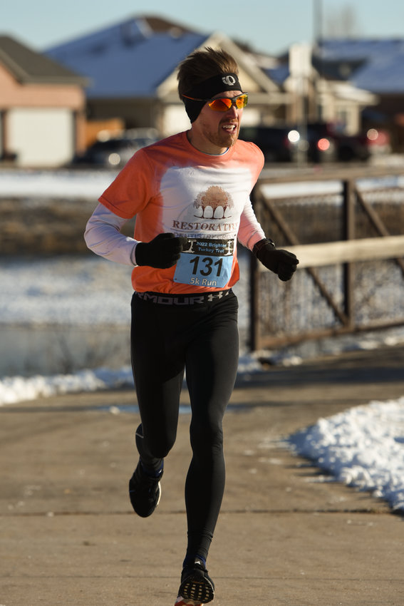 Zebulon Hanley is first across the finish line at this year's Brighton Turkey Trot. His time was 16:01.