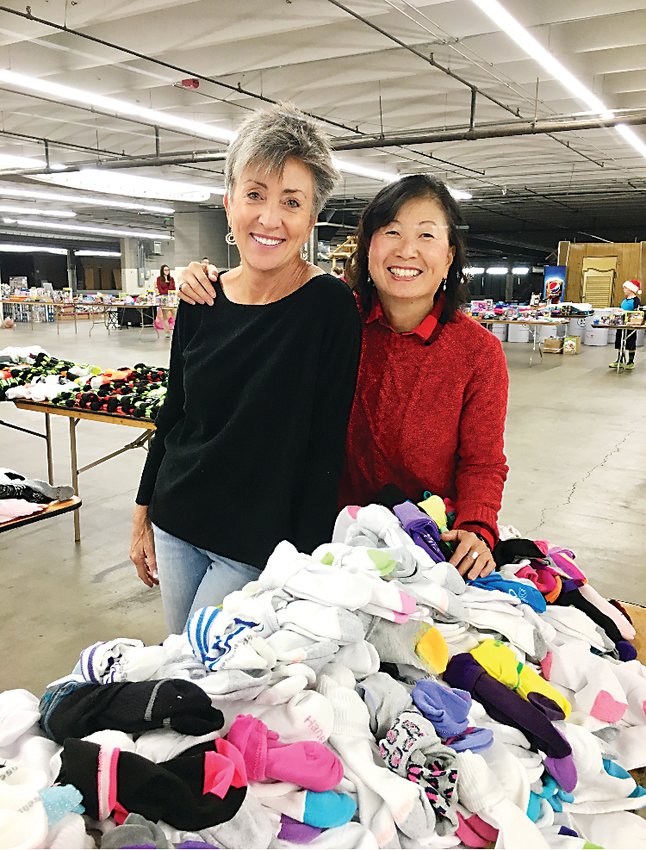 Sue Lee, left, and Phillis Shimamoto are the co-founders of the nonprofit, Sock It To 'Em Sock Campaign.
