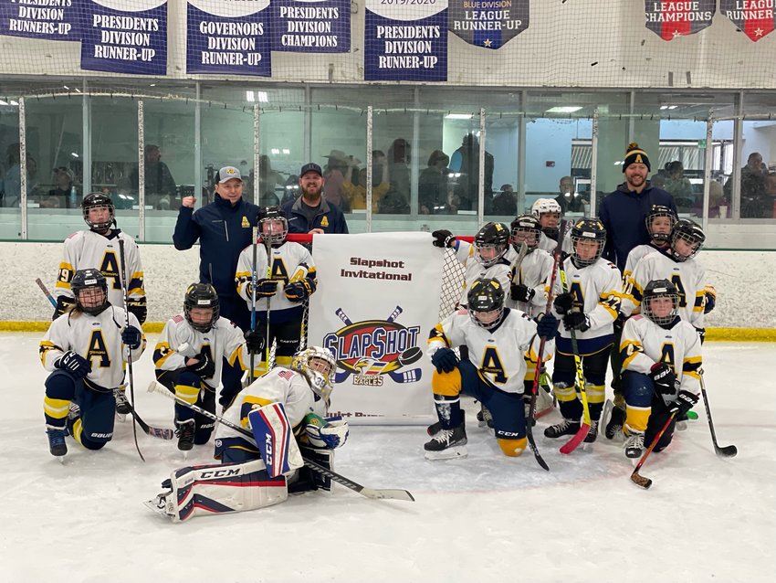 The Arapahoe Warriors 10U Yellow team poses after securing a second-place finish in the Slap Shot Tournament in Fort Collins