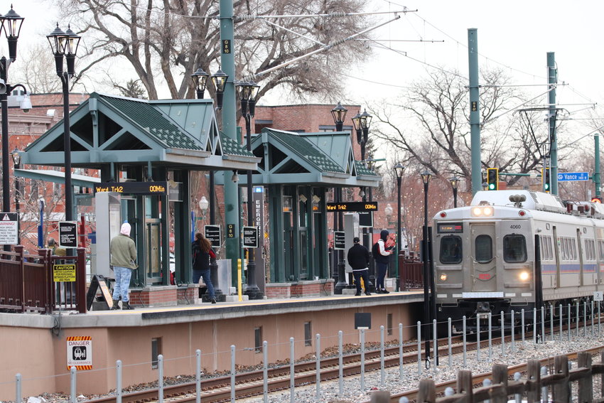 A train running along the G-Line departs the Arvada Olde Town station.