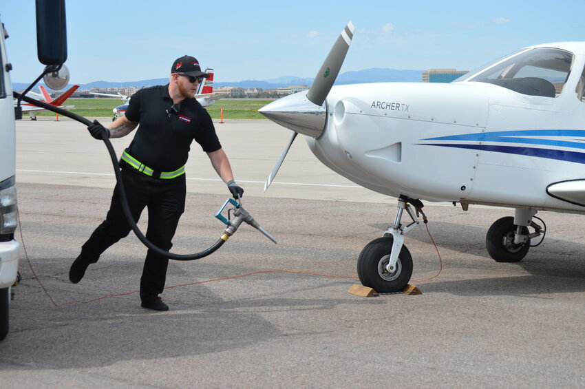 The May 3 celebration featured a worker of jetCenters of Colorado, a fixed-based operator that supplies fuel at Centennial Airport, pumping unleaded fuel into an aircraft owned by Aspen Flying Club, one of the flight schools at the airport.
