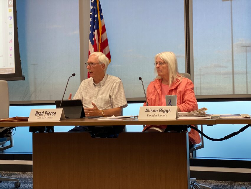 Brad Pierce, chair of the Centennial Airport Community Noise Roundtable, speaking during the Aug. 2, 2023, meeting. Sitting beside him is Alison Biggs, a Douglas County representative on the noise roundtable.