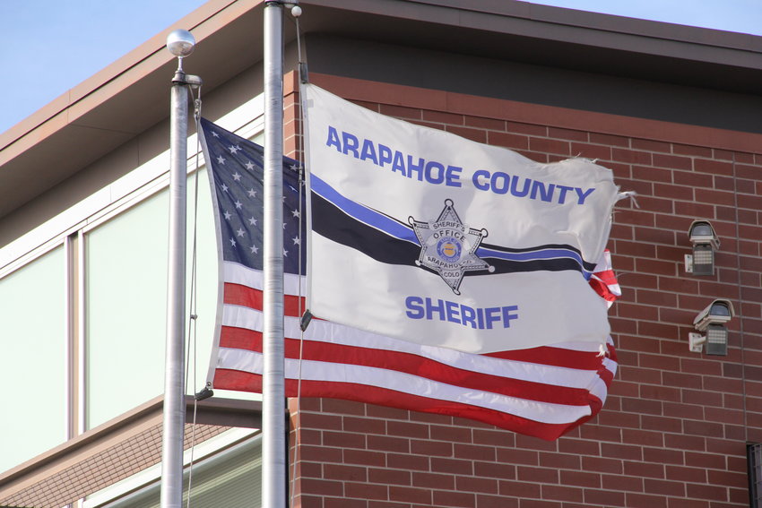 Flags fly at the Arapahoe County Sheriff's Office in the central Centennial area.