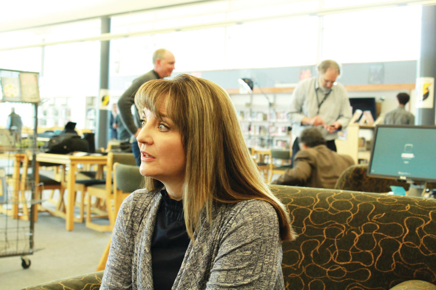 Coni Sanders is the daughter of Dave Sanders, a teacher who was killed during the Columbine shooting. Coni, shown here in the Columbine Hope Memorial Library, works with violent offenders and the mentally ill as a forensic therapist.