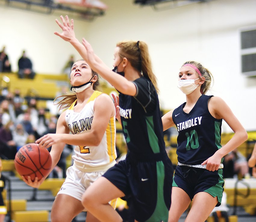 Green Mountain senior Olivia Sears, left, drives past Standley Lake sophomore Bayleigh Walling and freshman Kameron Mireles-Cianco during a Class 4A Jeffco League game Jan. 10 at Green Mountain High School. The Rams won 86-35 to push their conference winning streak to 30 games dating back to the 2018-19 season.