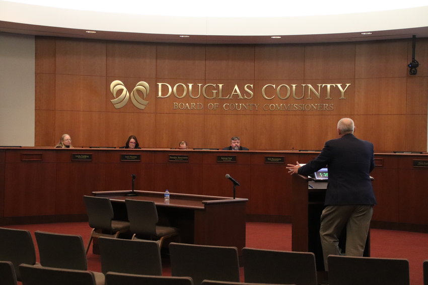 The members of the Douglas County Board of Health listen to a resident during public comment.