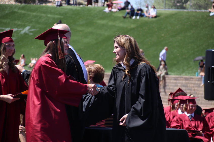Erin Kane, right, the superintendent for Douglas County School District, shook hands with the Ponderosa High School graduates as they received their diplomas May 17. Kane will welcome returning students to the new school year on Aug. 8.