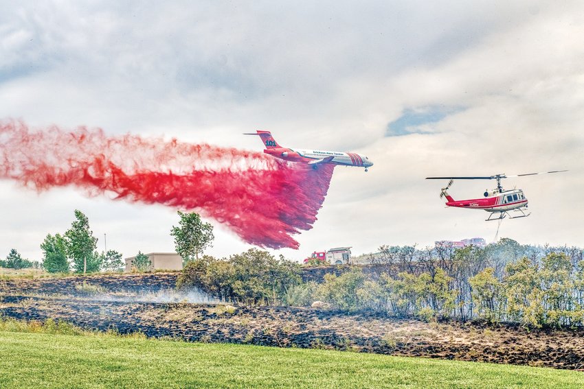 A plane drops fire retardant on the Chatridge 2 wildfire in Douglas County in 2020.