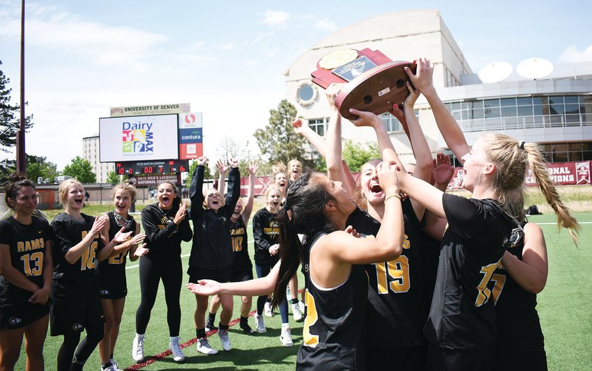 Green Mountain captains hoist the Class 4A girls lacrosse state championship trophy after a 16-10 victory against Thompson Valley on Sunday, May 22, at Peter Barton Stadium on the University of Denver campus. Senior Shea Murphy (19) led the Rams with eight goals to complete the remarkable postseason run by Green Mountain.