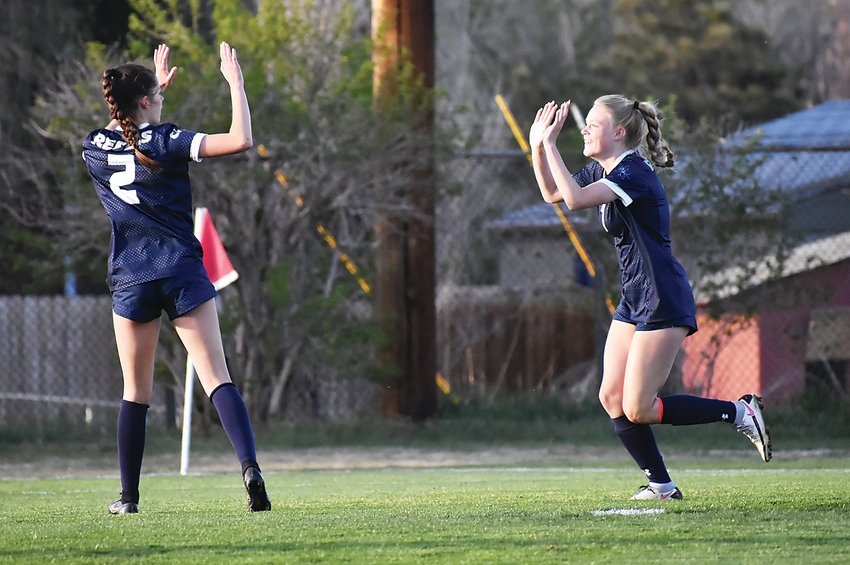 Columbine senior Riley Kaali-Nagy (7) celebrates her first playoff goal with sophomore Olivia Ashbrook (2) during the Rebels' 6-0 victory over Eaglecrest on May 10 at Lakewood Memorial Field. Columbine won 6-0 and then shutout ThunderRidge 1-0 back at Lakewood Memorial Field on May 13 to advance to the 5A state quarterfinals.