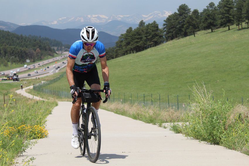 A Ride the Rockies participant bikes up the El Rancho to Genesee bike path on June 17. The six-day ride took participants across the state, and the final day's route had participants start in Breckenridge, go over Loveland Pass, through Clear Creek County and finish in Golden.