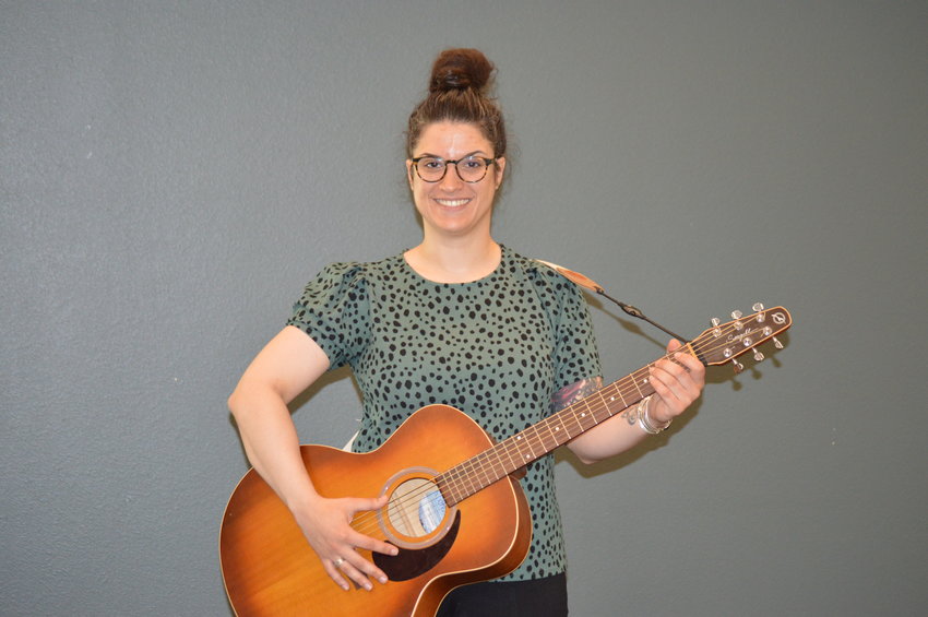 Music therapist Brittany Costa visited Koelbel Library June 14 to help raise awareness about the therapy service and how it can help others.